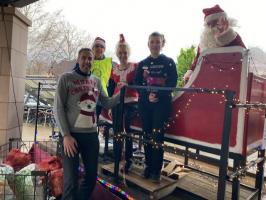 Booths Manager and Staff with Rotary Club of Lunesdale Santa and sleigh.